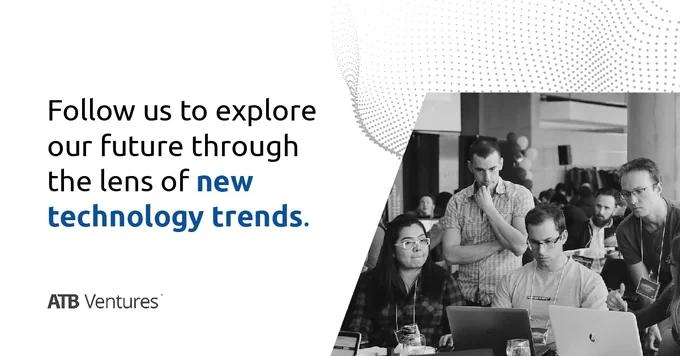 Photo of group of people around laptops and the following text: "Follow us to explore our future through the lens of new technology trends."