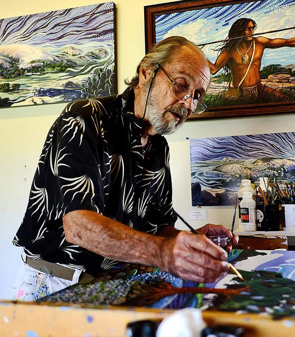 Ira Kennedy paints in his studio