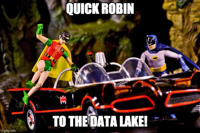 Batman and Robin hopping in the Batmobile "Quick Robin to the data lake!"