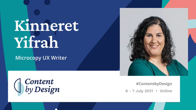 Kinneret smiles arms folded wearing a green blouse and curly hair, 