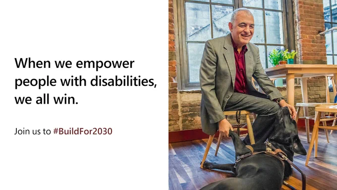 Photo of a man smiling, with his dog. Text reads: When we empower people with disabilties, we all win. Join us to #BuildFor2030.