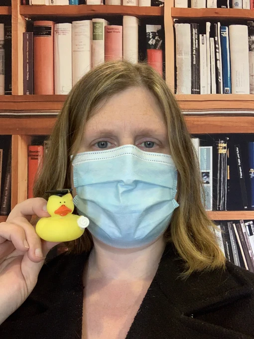 Librarian holding a grad study duck