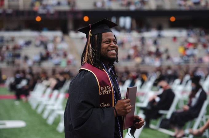 Texas State University Bobcat Stadium Spring 2021 Graduation Student Smiling