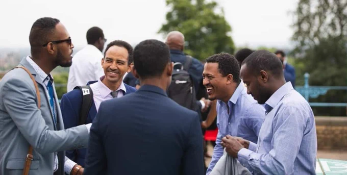 Image of Chevening Scholar Seifu laughing with his friends.