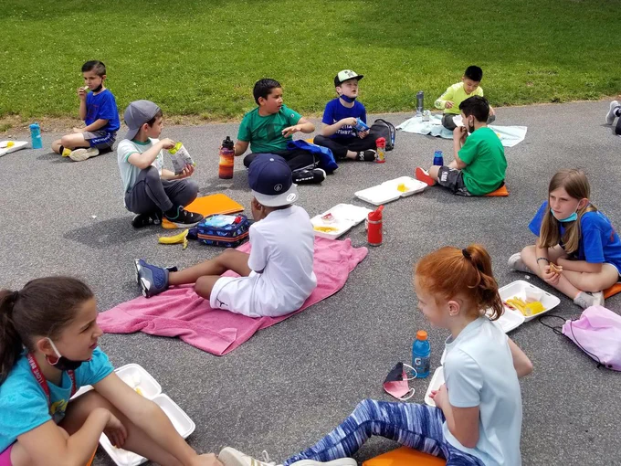 Students at Washingtonville enjoy snacks and drinks during field day.