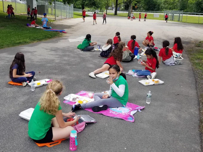 Students at Washingtonville enjoy snacks and drinks during field day.