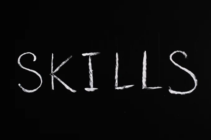 'SKILLS' written with chalk on dark ground - Photo by Anna Tarazevich from Pexels
