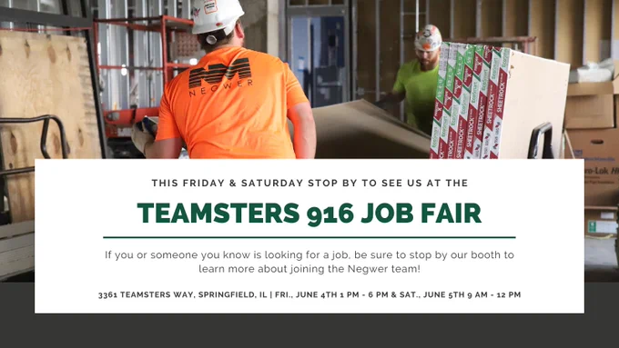 construction laborers stacking drywall