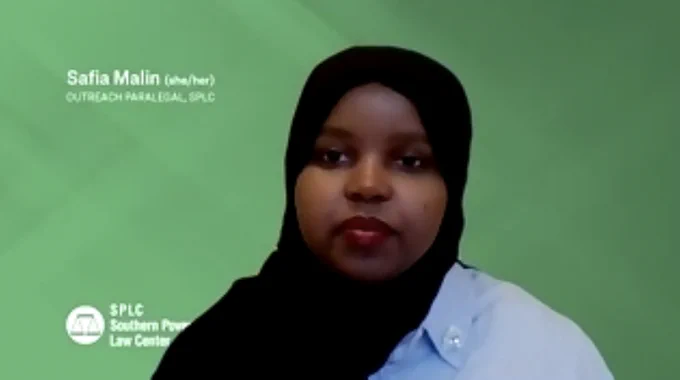 Safia Malin, SPLC Outreach Paralegal, a dark skinned woman wearing red lipstick and a black head covering