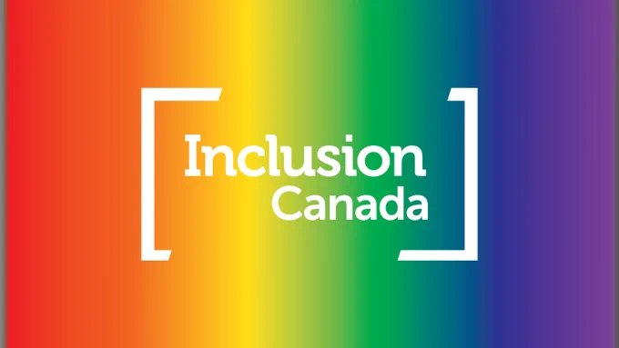 Inclusion Canada logo in white with the pride colour gradients in the background. 