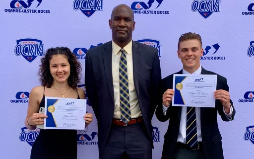 Dr. Washington, Superintendent of Washingtonville Central School District, takes a photo with high school seniors Olivia Brown and Ryan Lerner, who were named 2020-21 Scholar Athletes.