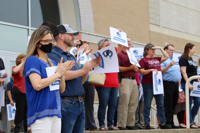 Crowder faculty, staff, and guests cheer for Roughrider Baseball during a send off to the World Series.