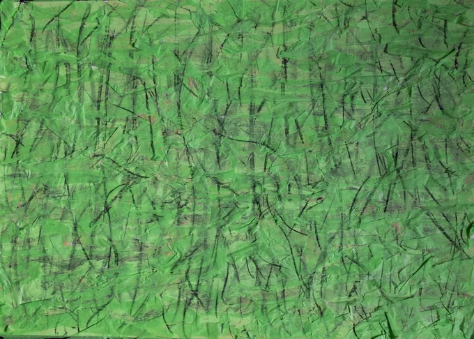 By Sarah: Layered and stuck down torn green tissue paper with lots of charcoal lines on top, resembling a forest.