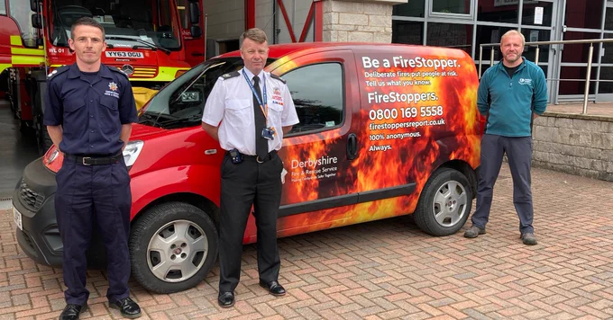 Fire Service and United Utilities representatives with the newly wrapped vans.
