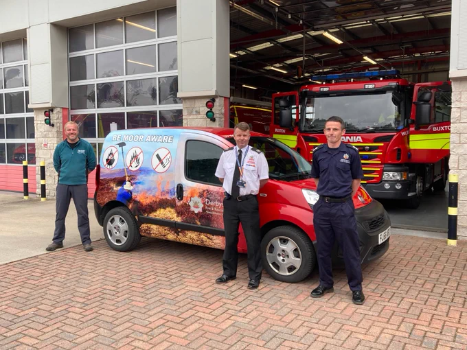 Fire Service and United Utilities representatives with the newly wrapped vans.