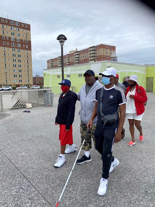 Image of Alphapointe team members walking in Rockaway Beach. 