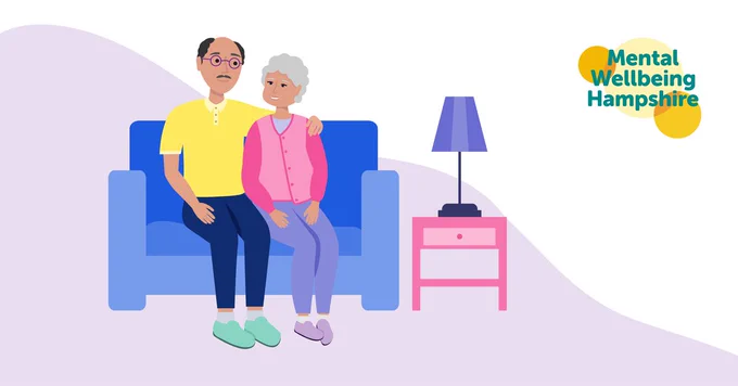 Couple sat together on sofa, and Mental Wellbeing Hampshire logo