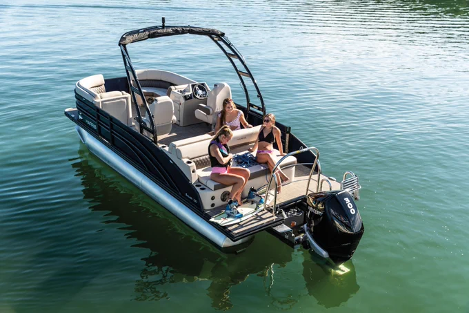 Three Girls getting ready to Wakeboard on a Harris Pontoon Boat