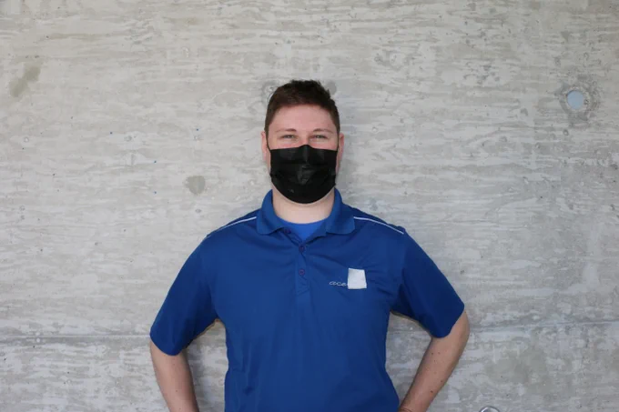 Pictured: ACE student Eric Whalls standing against a wall