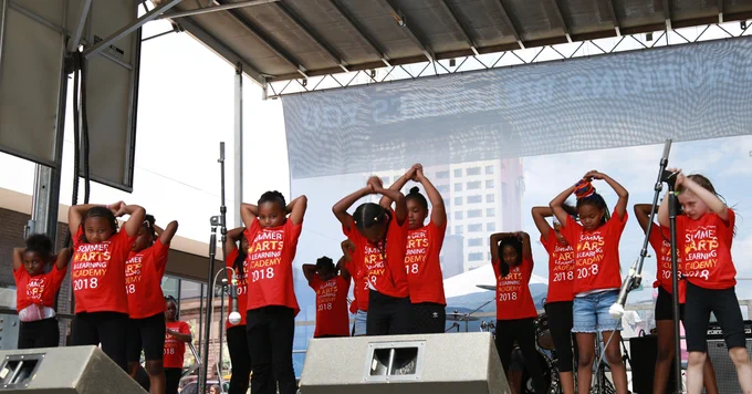 Students performing on stage