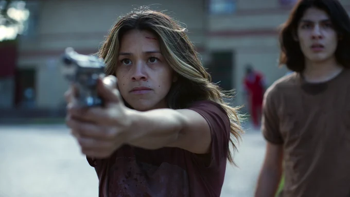Gina Rodriguez armed and ready to protect her kid in "Awake"