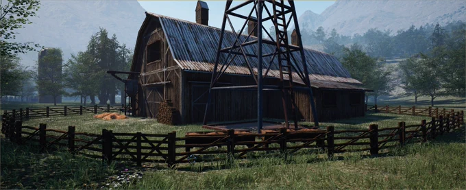 Barn surrounded by a radio tower and fences. In a field.