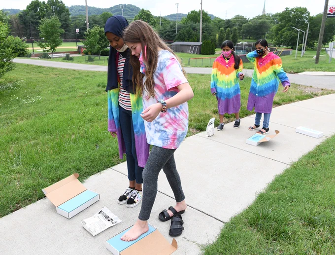 students taking imprints of their feet.