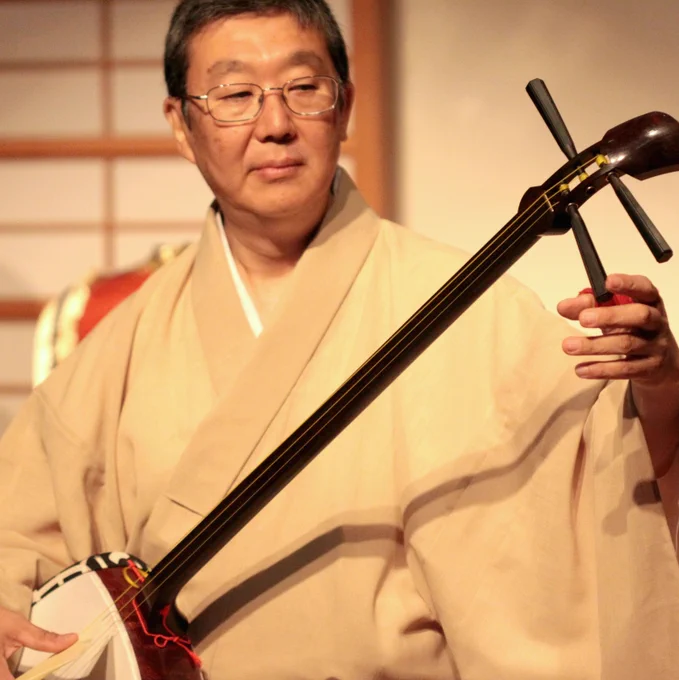 Tatsu Aoki holds the shamisen