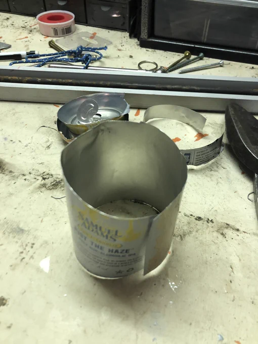 A cylinder of aluminum from a beer can with the top and bottom cut off.