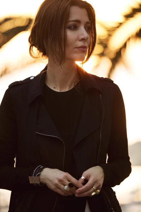 Author Elif Shafak, looking off to the left