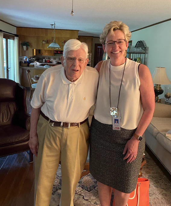 Two superintendents from the same school district standing beside each other smiling. One superintendent served in the role from late 1970s - mid 1990s; the other superintendent serves now, in 2021.