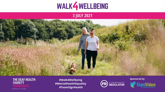 Two women walking with a dog in a park. Banner with Walk4Wellbeing logo and date: 3 July 2021
