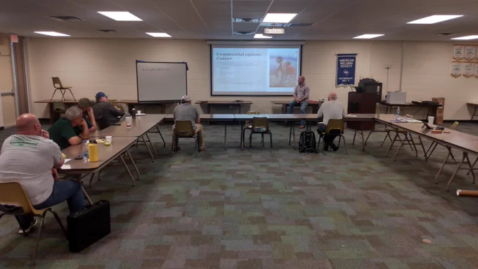 Jordan Harris from Davy Crockett High School presents information about being a Navy Diver and Underwater Welder to a group of welding and AG instructors.