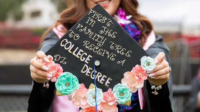 Graduation cap that reads first in the family tree to receive a college degree.