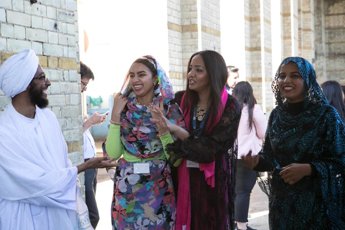 A group of male and female Chevening Scholars laughing 