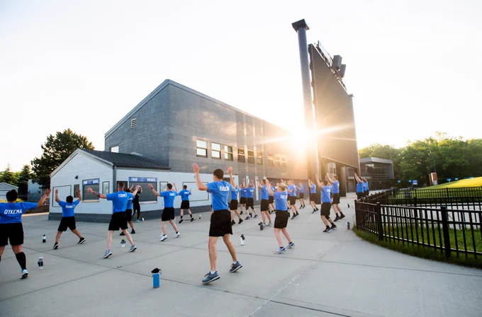 Grand Valley Police Academy cadets complete a sunrise physical training exercise at Lubbers Stadium on Grand Valley State University's Allendale Campus on June 2.