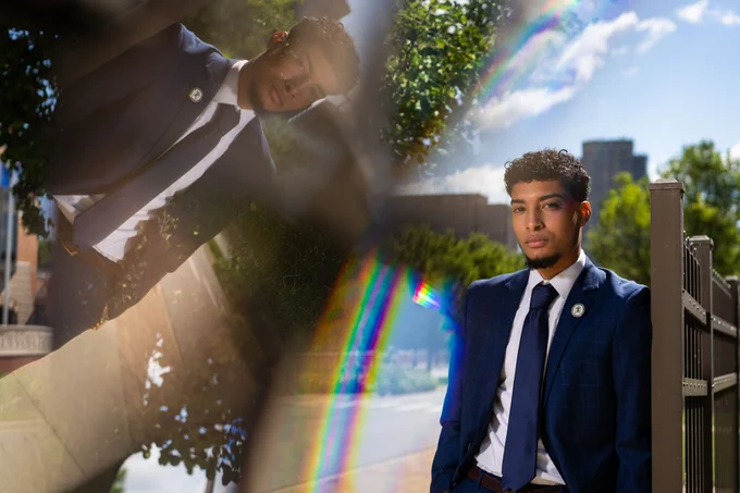 Grand Valley State University student Javier Guillen stands outside his on-campus housing in downtown Grand Rapids, MI on June 15.