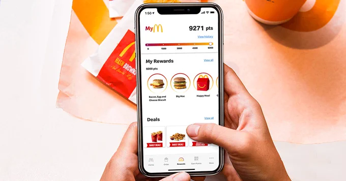 A phone with the screen pulled up to MyMcDonald's Rewards.
