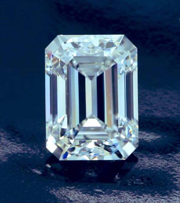 A Large Emerald cut diamond with mirror like facets and seemingly flawless clarity