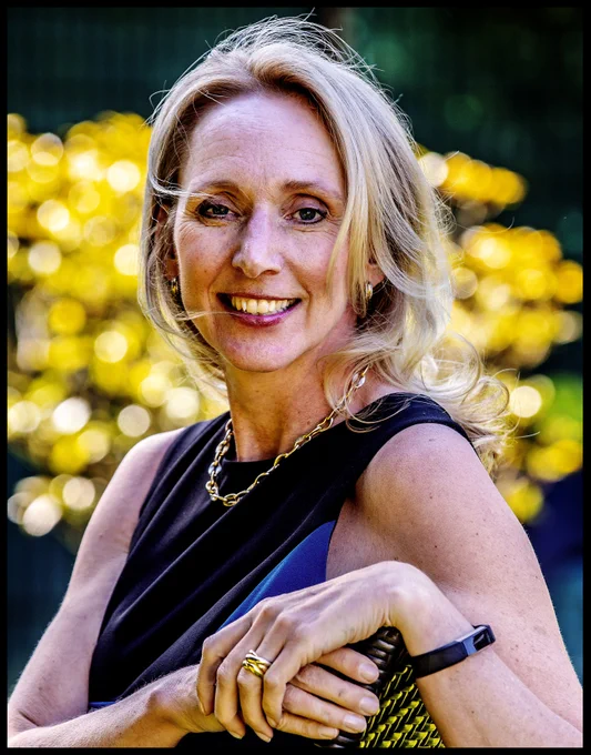 Middle-aged Caucasian woman smiling. 