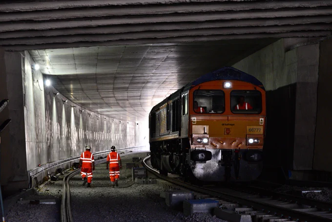 The very first locomotive to run through the new tunnel at Werrington is seen inside the tunnel.