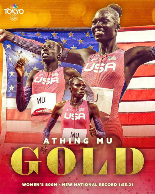 Athing Mu holding the American flag and running
