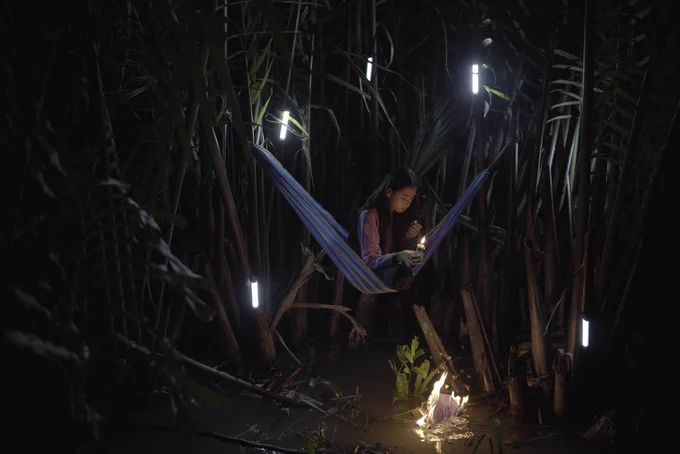 A video still featuring a girl sitting in a hammock by Thao Nguyen Phan