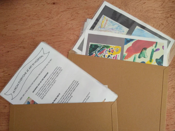 Two envelopes containing drawing worksheets and images to work from.