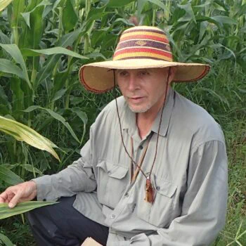 A man in a field wears a hat and inspects plants for signs of disease. That man is Roger Shivas, a keynote speaker at the APPS conference.

