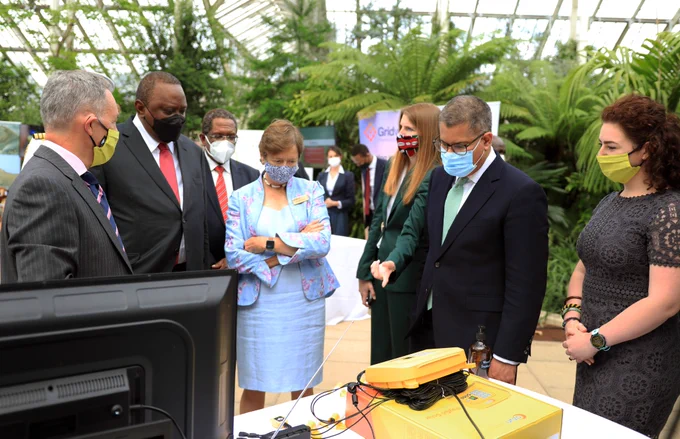 President Uhuru Kenyatta, UK High Commissioner to Kenya Jane Marriott, and COP26 President Alok Sharma join Azuri CEO Simon Bransfield-Garth around the Azuri Technologies showcase stand at the UK-Kenya Climate Action Summit