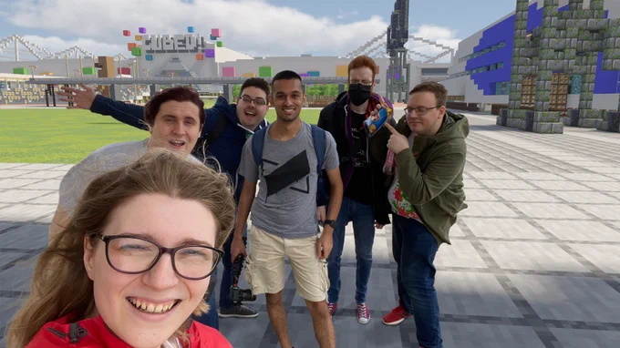 The RASA Studios team have been cropped out of their picture in front of ExCeL London and put in the same spot in front of Cubed! 2020 which used the convention center for that year's event.