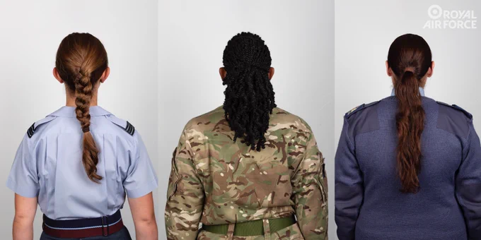 Three RAF females with their backs to camera showing different hair styles under the new policy