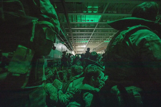 Men of 40 Commando are packed in an Australian landing craft ready for the dawn raid at Forrest Beach