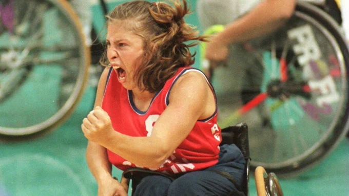Wheelchair basketball athlete punches the air